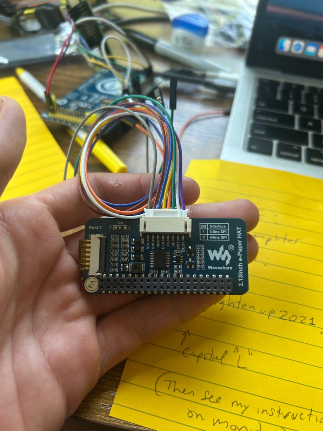 Eight wires, eight colors, and a yellow notepad full of instructions.