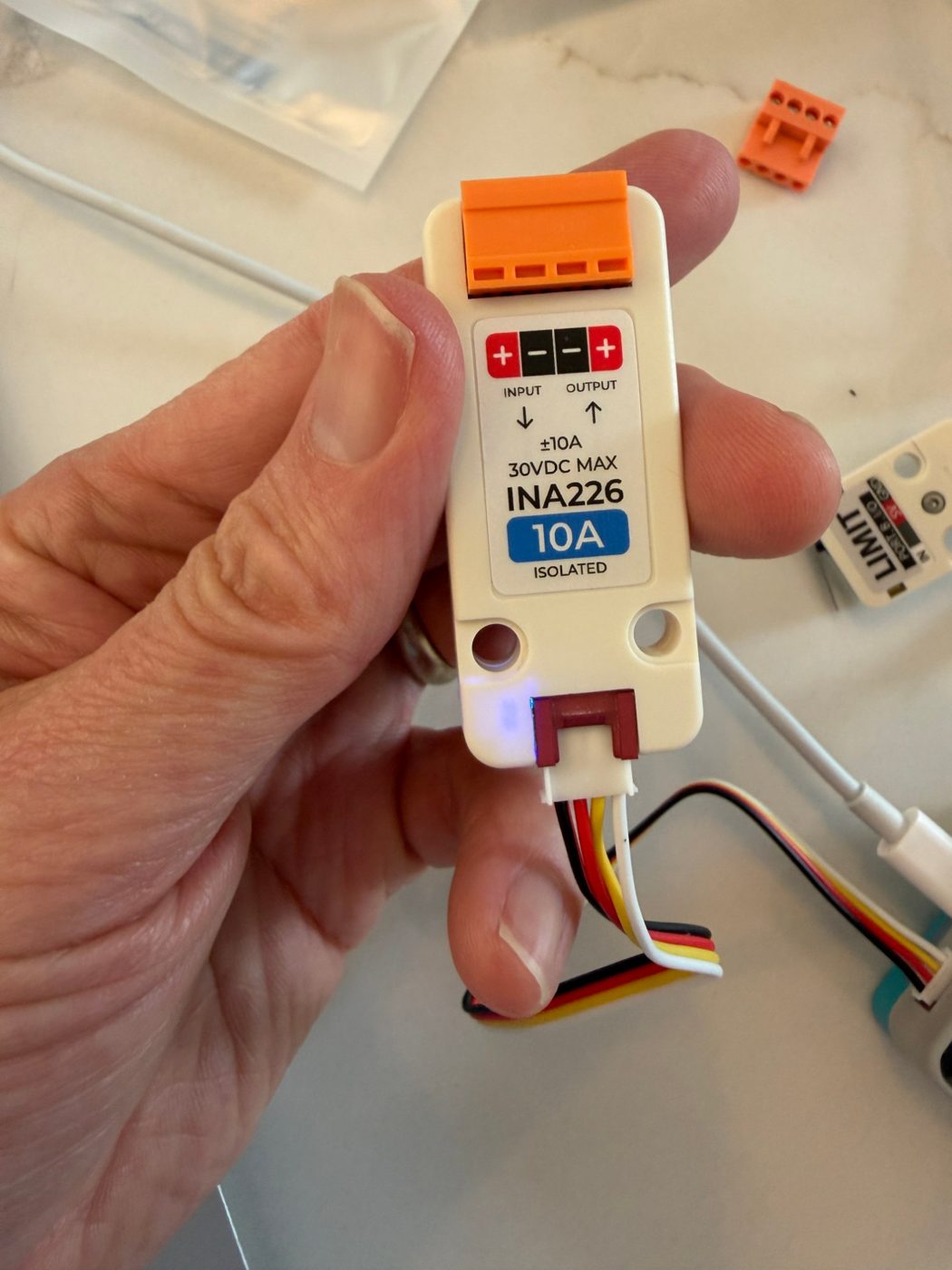 My charge sensor (an INA226). It measures how much power is flowing to the phone, so I know it’s really charging.